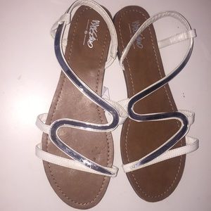 white sandals with silver design